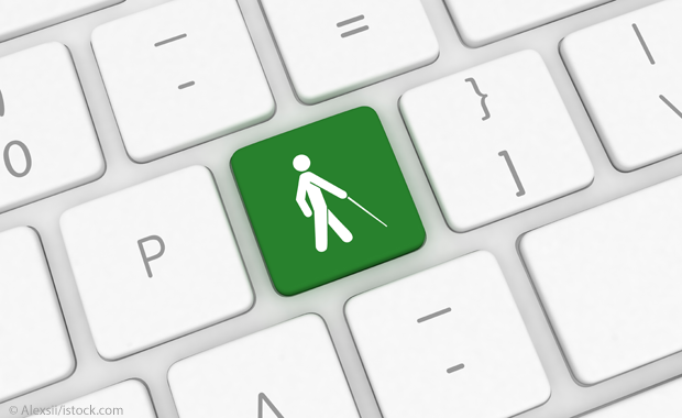 Tastatur mit einer grünen Taste mit einem Blinden-Icon